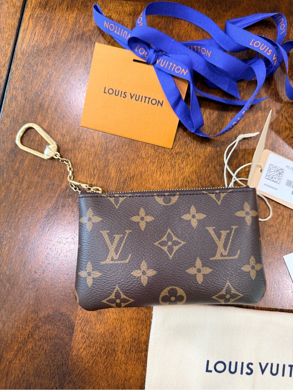 Authentic Louis Vuitton Key Pouch Small Monogram with tags/receipt
